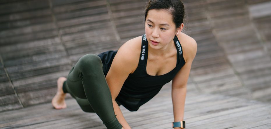 A woman stretches -Yoga Therapy