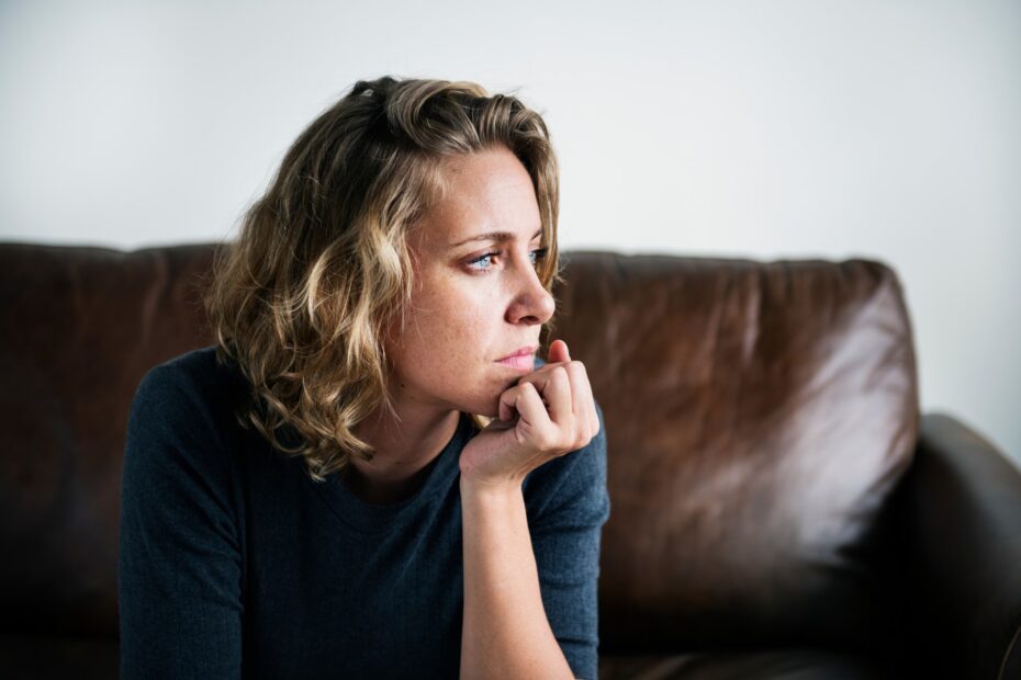 woman looking pensive - Mental Health Awareness