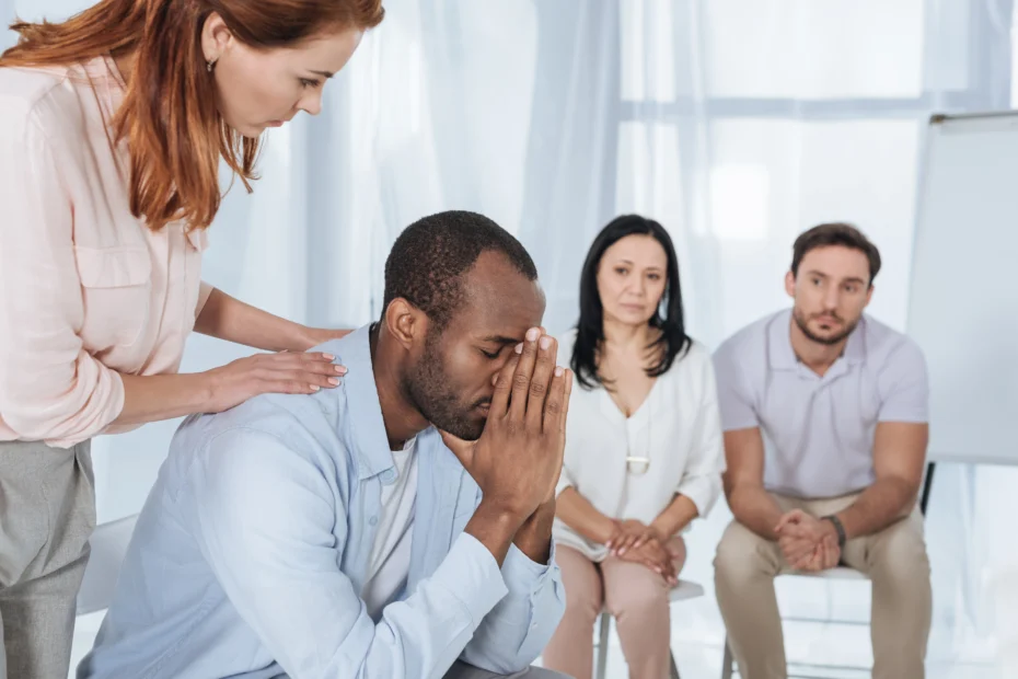 man with depression head in hands - cocaine addiction therapy concept